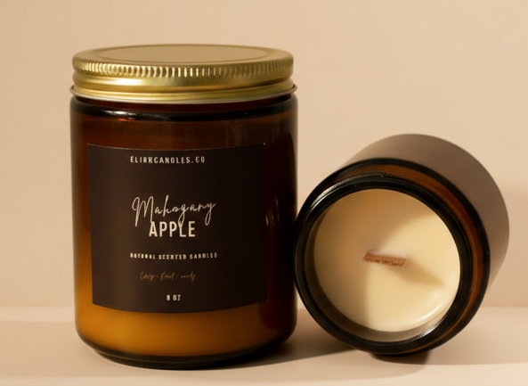 Candle jar with a gold lid and label on a wooden surface