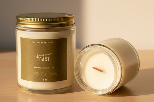 Candle jar and lit candle on a wooden surface with a neutral background